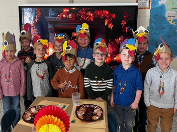 students with turkey hats